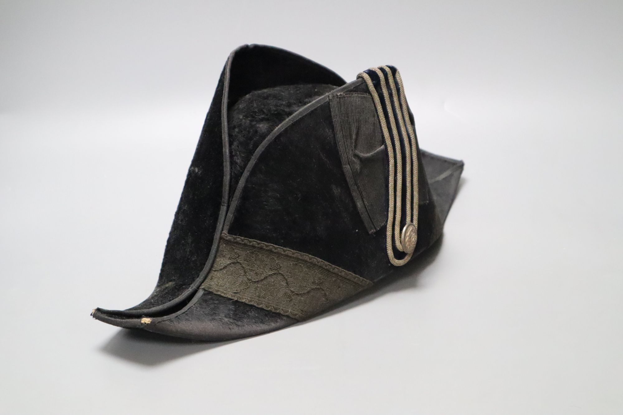 A WWI bicorn naval hat with Kings crown button
